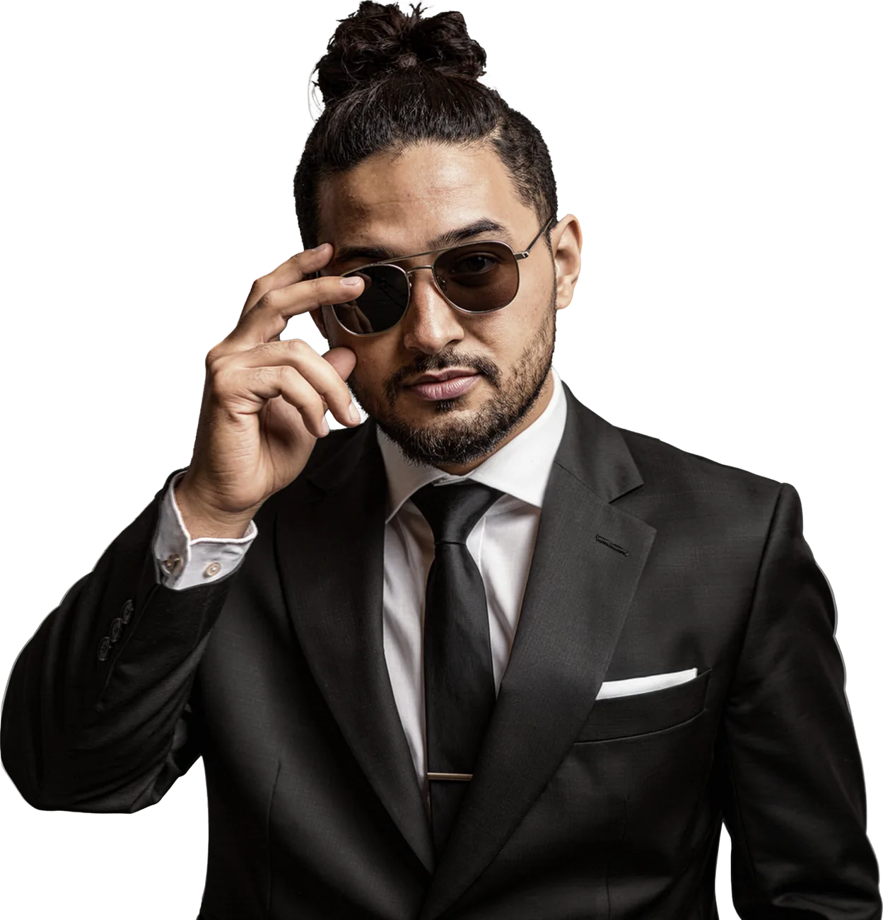 Khalid Aharran in a black suit, adjusting his sunglasses